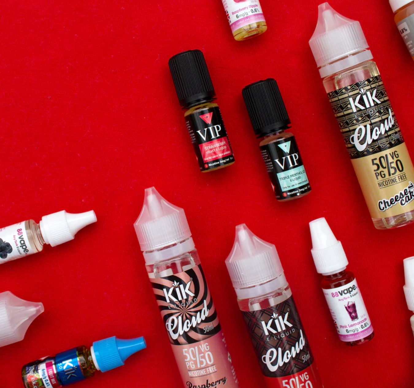 Image of multiple e-liquids on a red background